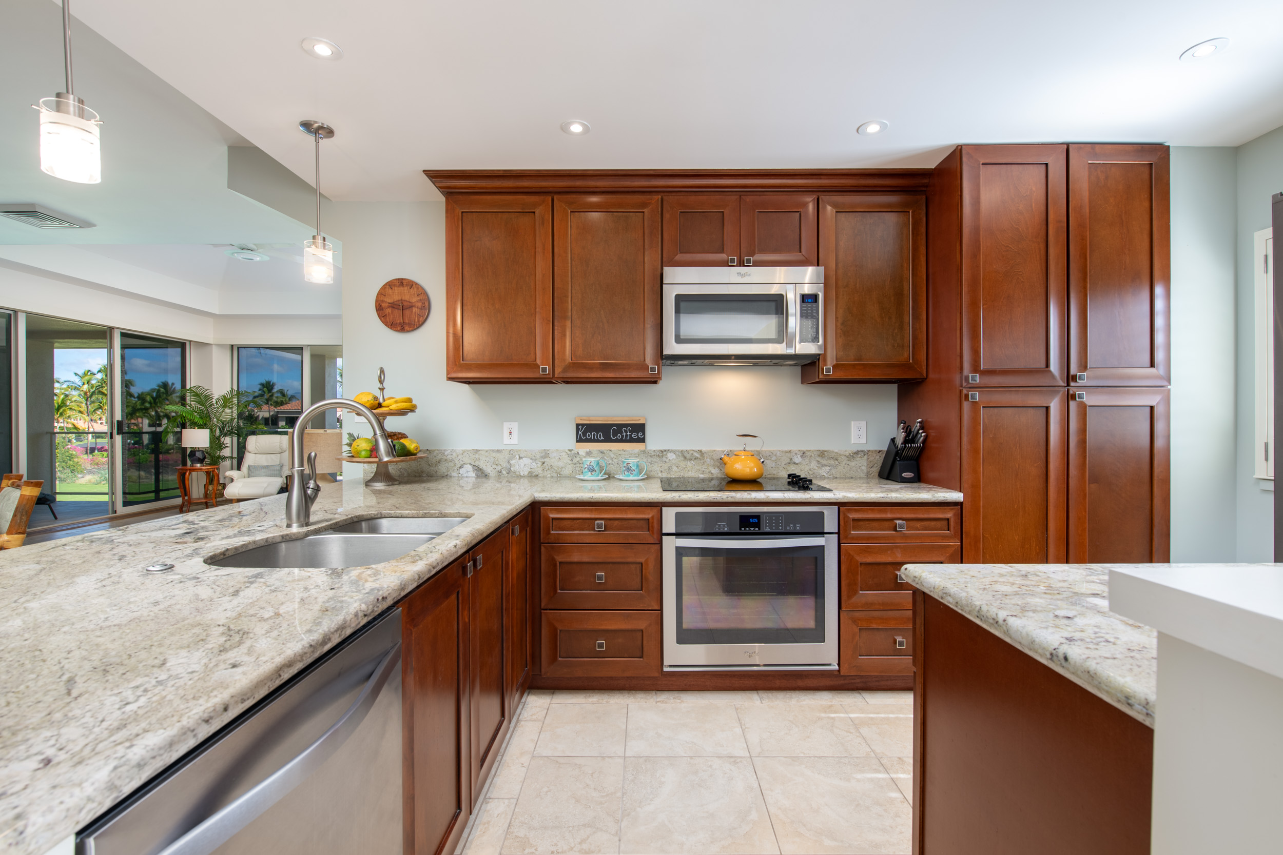 69-1010 Keana Place, Unit G303 Waikoloa, HI 96738 - Photo 1 of 30 a kitchen with stainless steel appliances granite countertop a sink stove and refrigerator