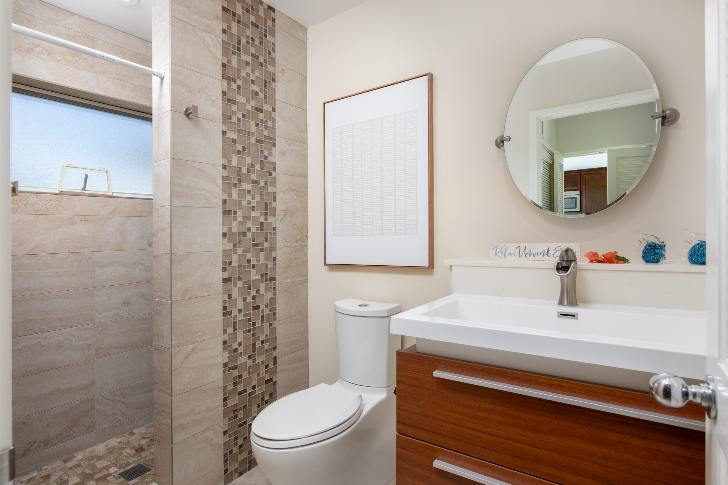 69-1010 Keana Place, Unit G303 Waikoloa, HI 96738 - Photo 15 of 30 a bathroom with a sink a toilet and shower curtain