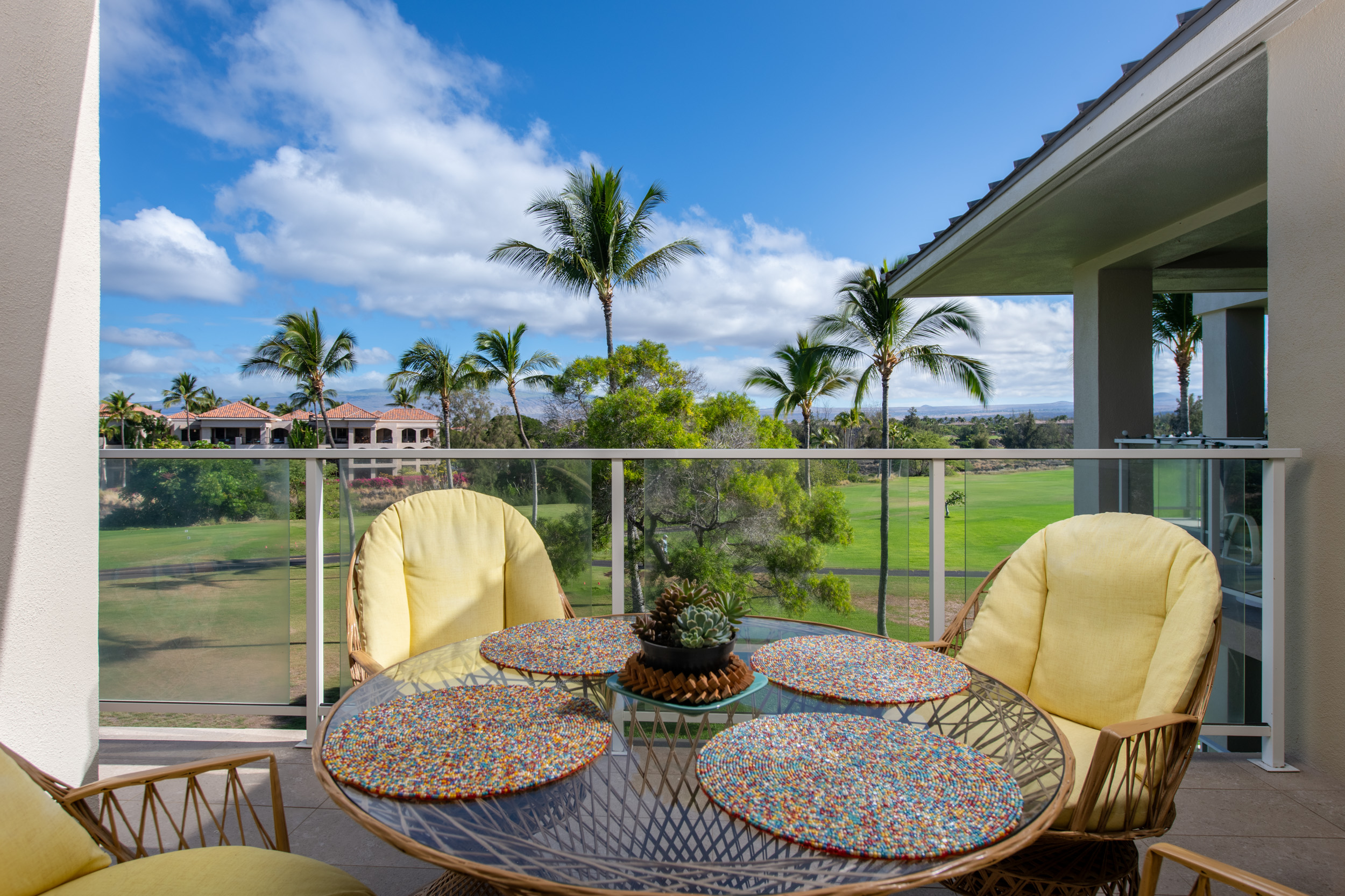 69-1010 Keana Place, Unit G303 Waikoloa, HI 96738 - Photo 2 of 30 a view of a swimming pool with a dining table and chairs