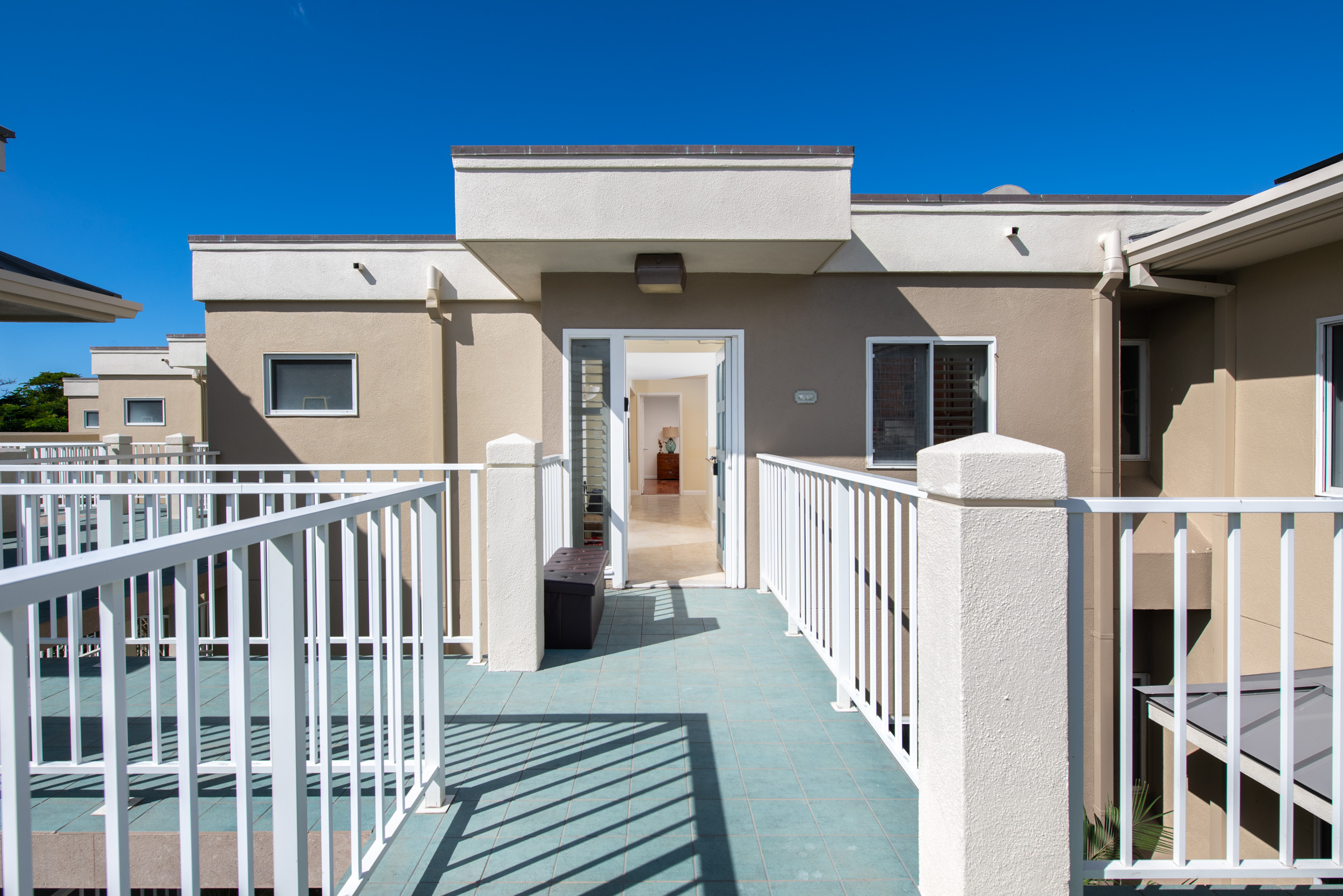69-1010 Keana Place, Unit G303 Waikoloa, HI 96738 - Photo 25 of 30 a view of a house with wooden fence