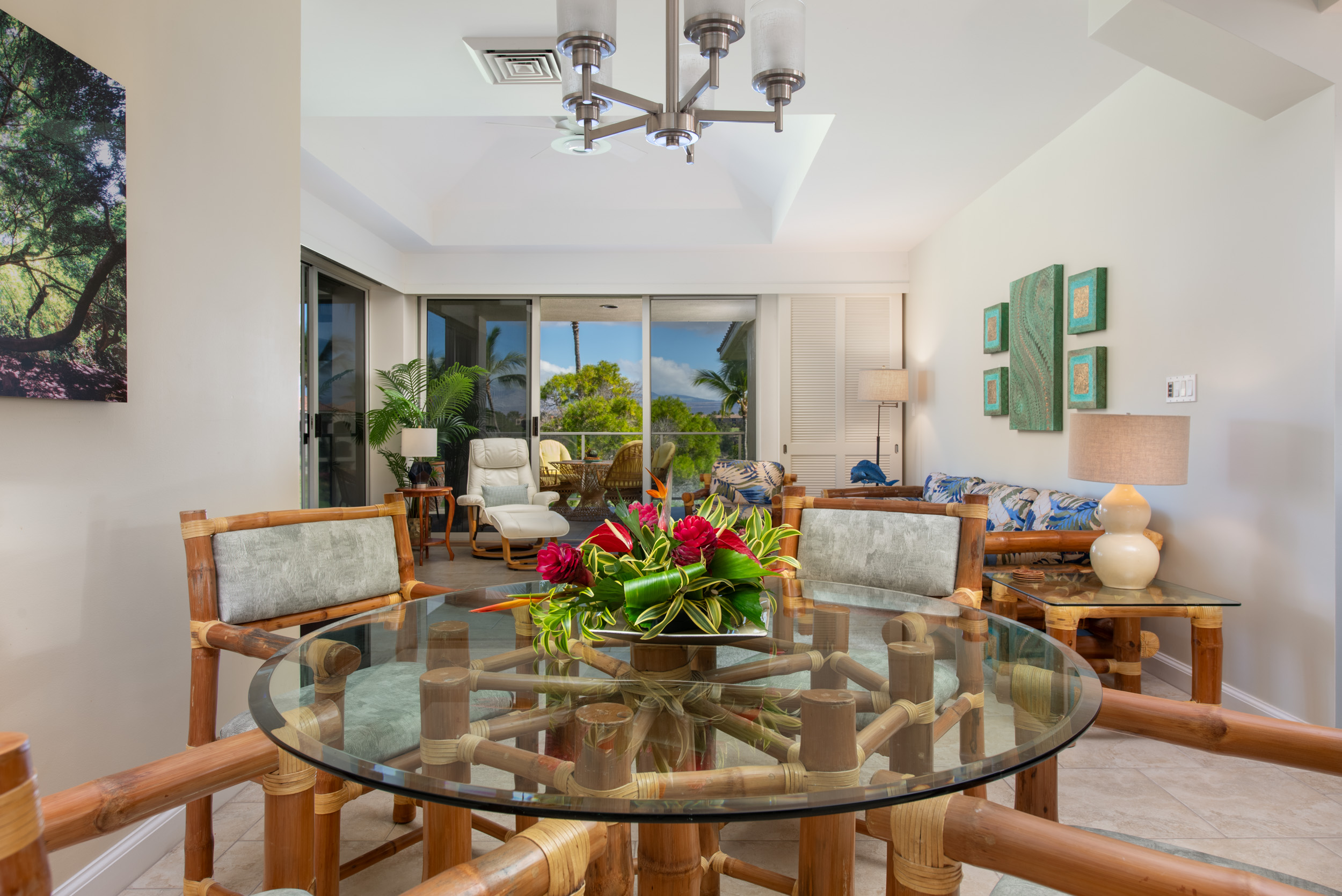 69-1010 Keana Place, Unit G303 Waikoloa, HI 96738 - Photo 6 of 30 a dining room with furniture and flowers