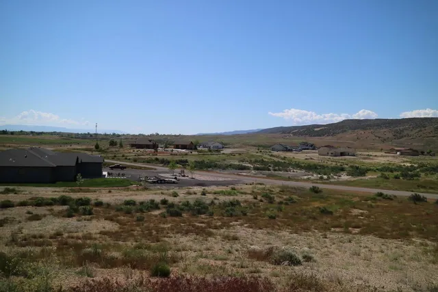 a view of a town with mountains in the background