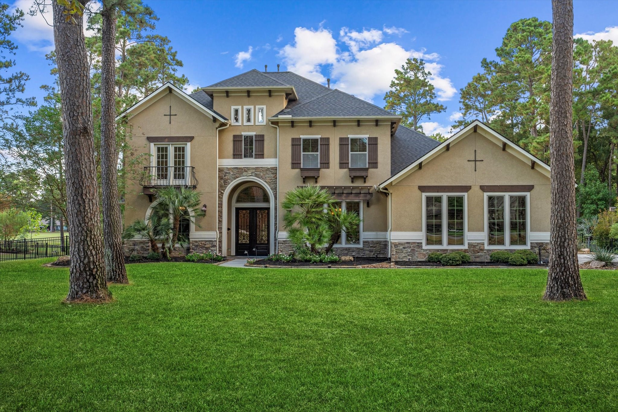 28733 Lakeside Green Magnolia, TX 77355 - Photo 2 of 49 a front view of a house with a garden