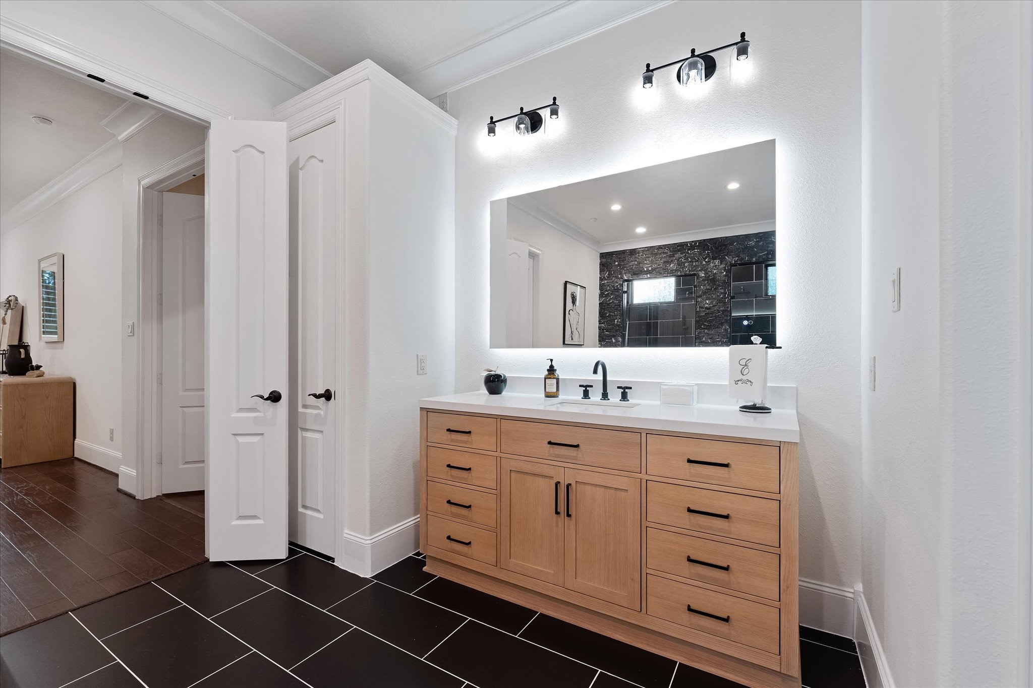 28733 Lakeside Green Magnolia, TX 77355 - Photo 40 of 49 a bathroom with a double vanity sink a mirror and a