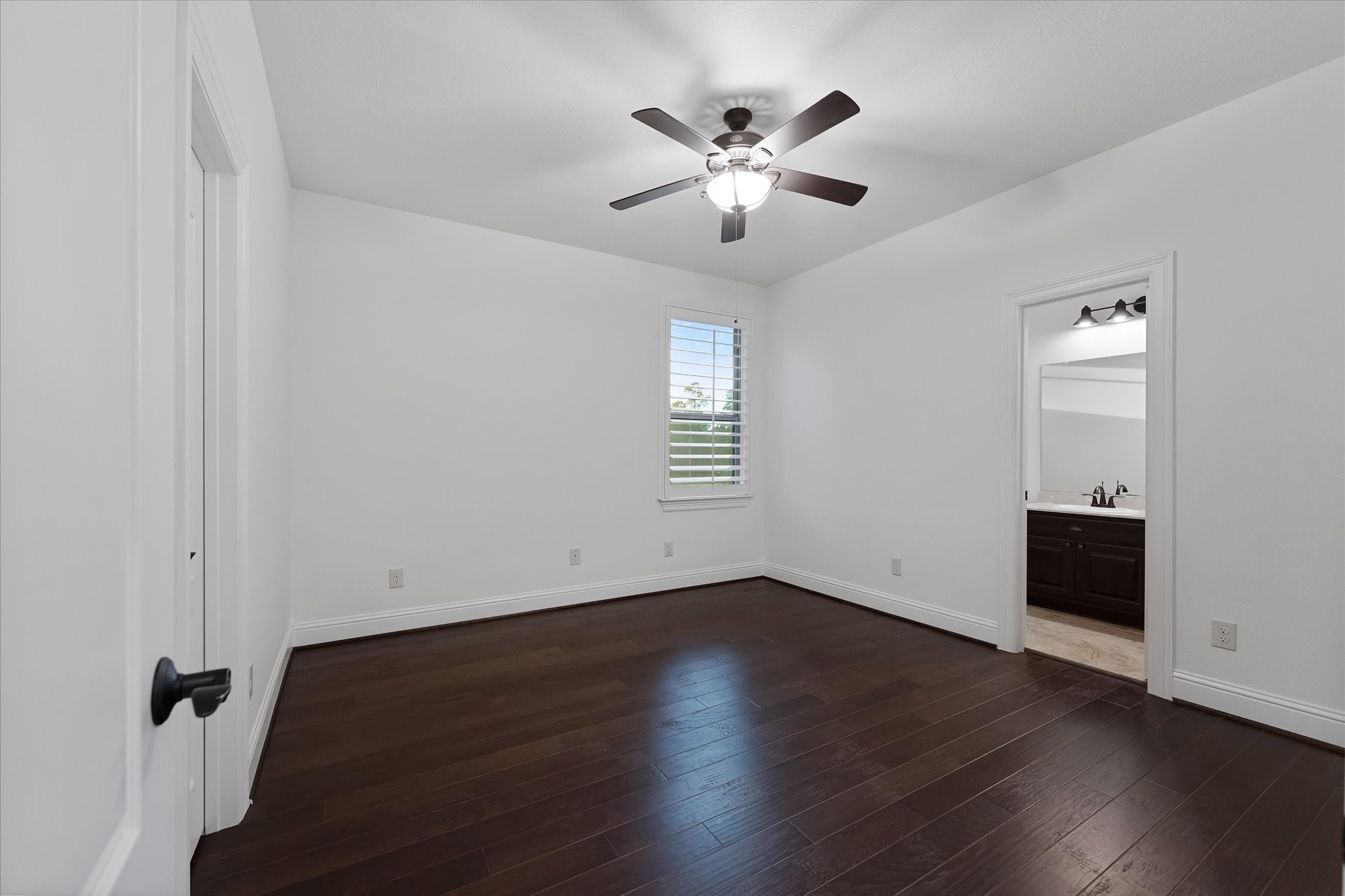 28733 Lakeside Green Magnolia, TX 77355 - Photo 44 of 49 a view of an empty room with wooden floor and a window