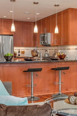 a kitchen with a sink a counter and cabinets