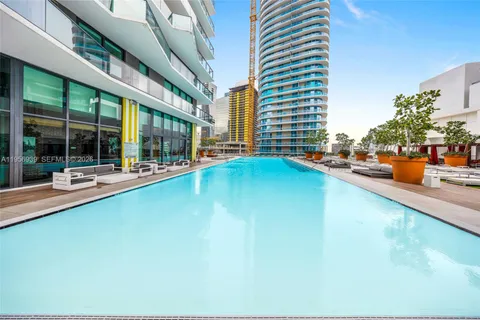 a view of swimming pool with outdoor seating
