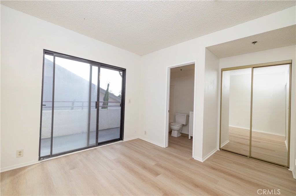730 West 4th Street, Unit 413 Long Beach, CA 90802 - Photo 11 of 16 a view of empty room with wooden floor and closet