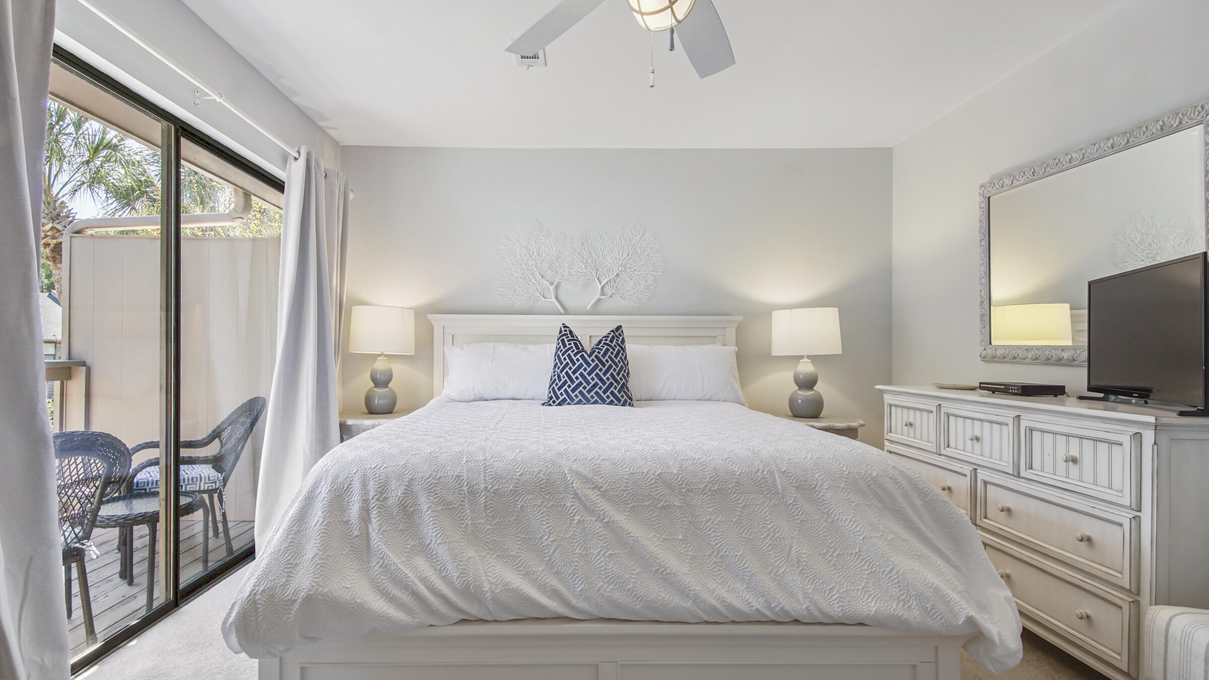 51 Cypress Street, Unit 275 Santa Rosa Beach, FL 32459 - Photo 14 of 37 a bedroom with a large bed and flat tv screen on the dresser