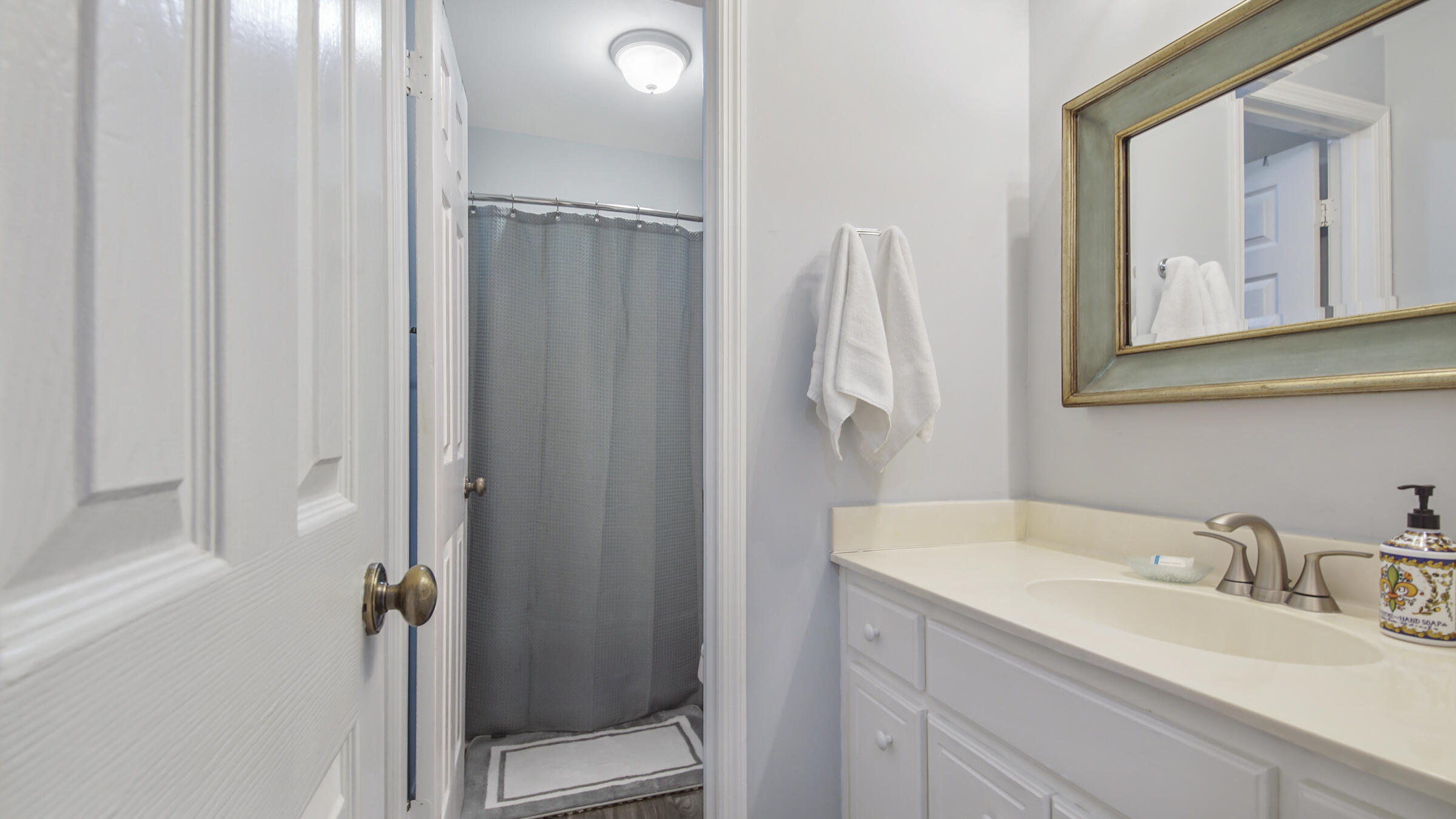 51 Cypress Street, Unit 275 Santa Rosa Beach, FL 32459 - Photo 18 of 37 a bathroom with a sink and mirror