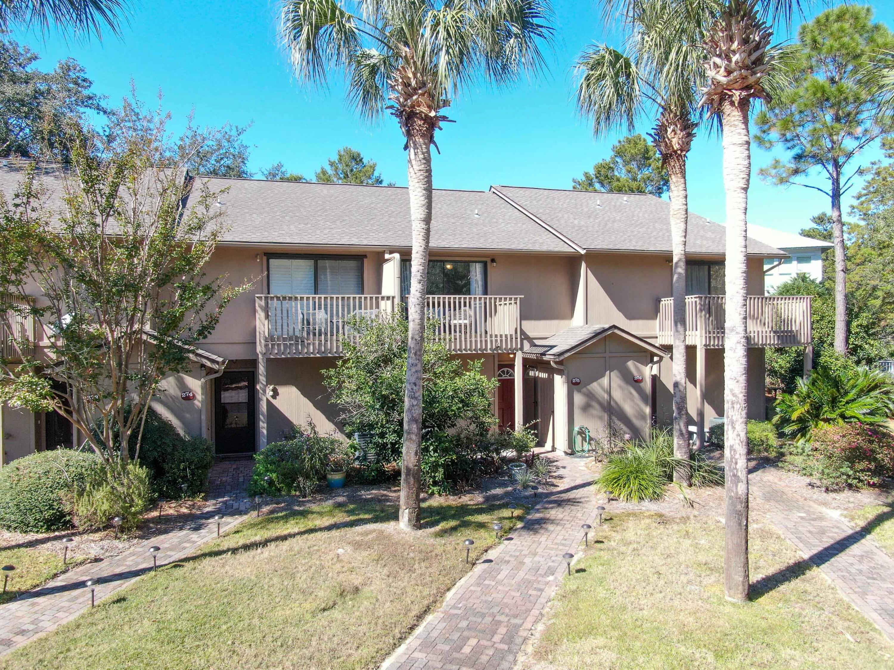 51 Cypress Street, Unit 275 Santa Rosa Beach, FL 32459 - Photo 27 of 37 a house that has a tree in front of it