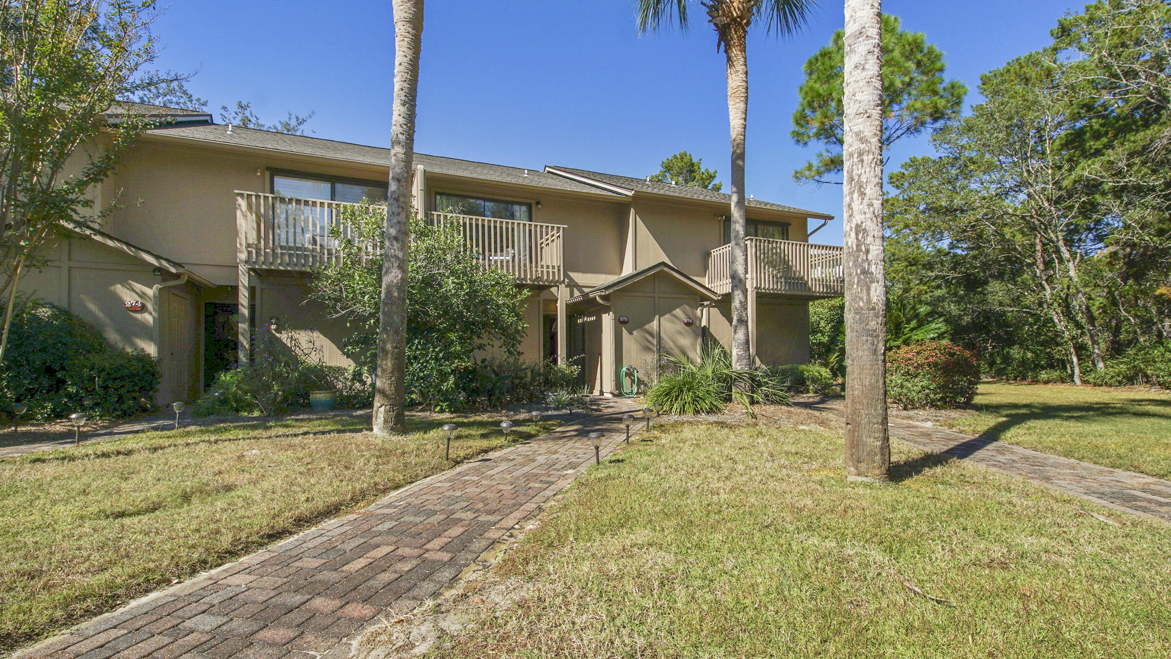 51 Cypress Street, Unit 275 Santa Rosa Beach, FL 32459 - Photo 28 of 37 a front view of a house with a yard