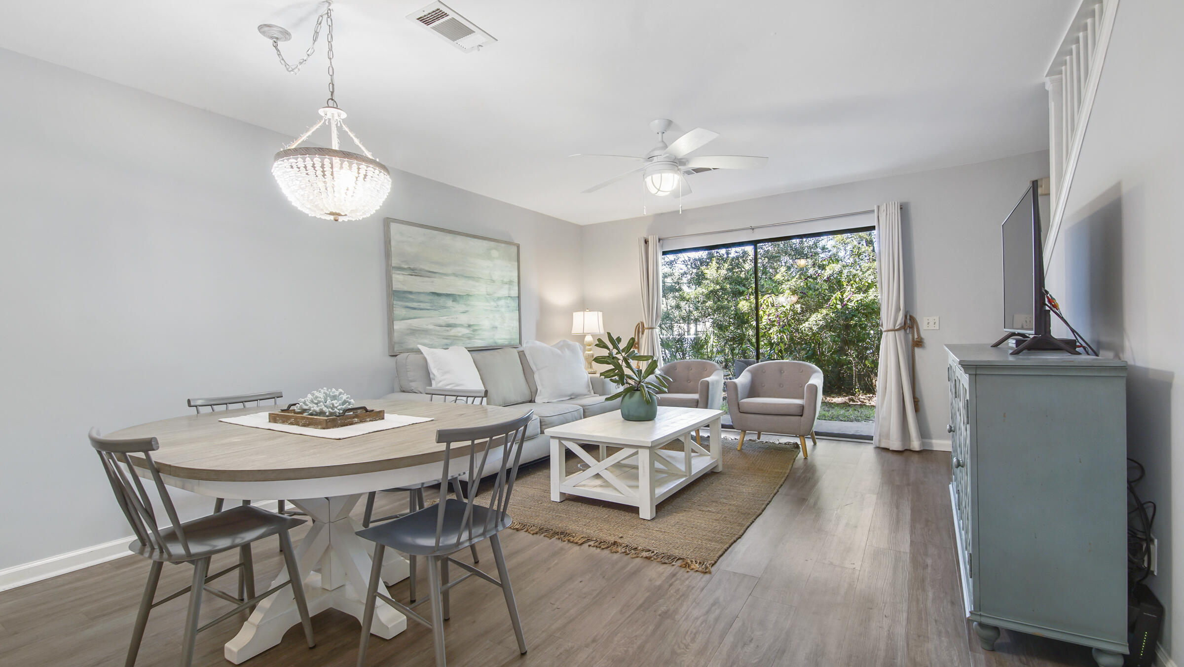 51 Cypress Street, Unit 275 Santa Rosa Beach, FL 32459 - Photo 3 of 37 a view of a dining room with furniture window and wooden floor