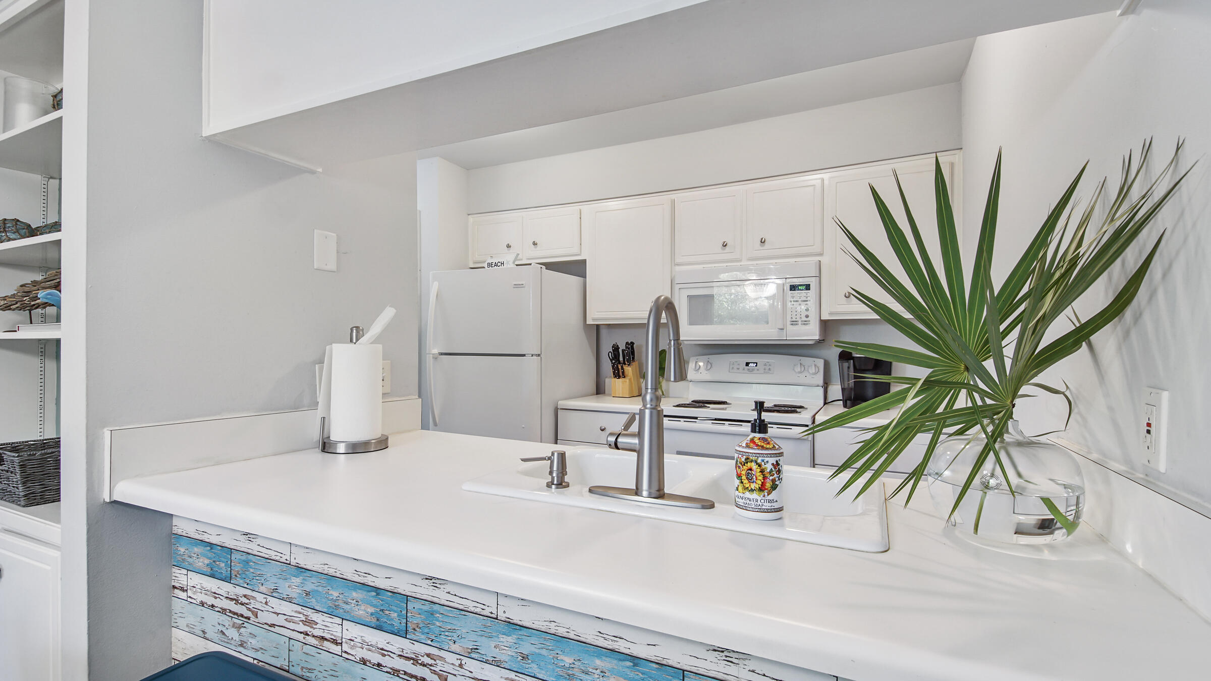 51 Cypress Street, Unit 275 Santa Rosa Beach, FL 32459 - Photo 8 of 37 a kitchen with a refrigerator and a sink