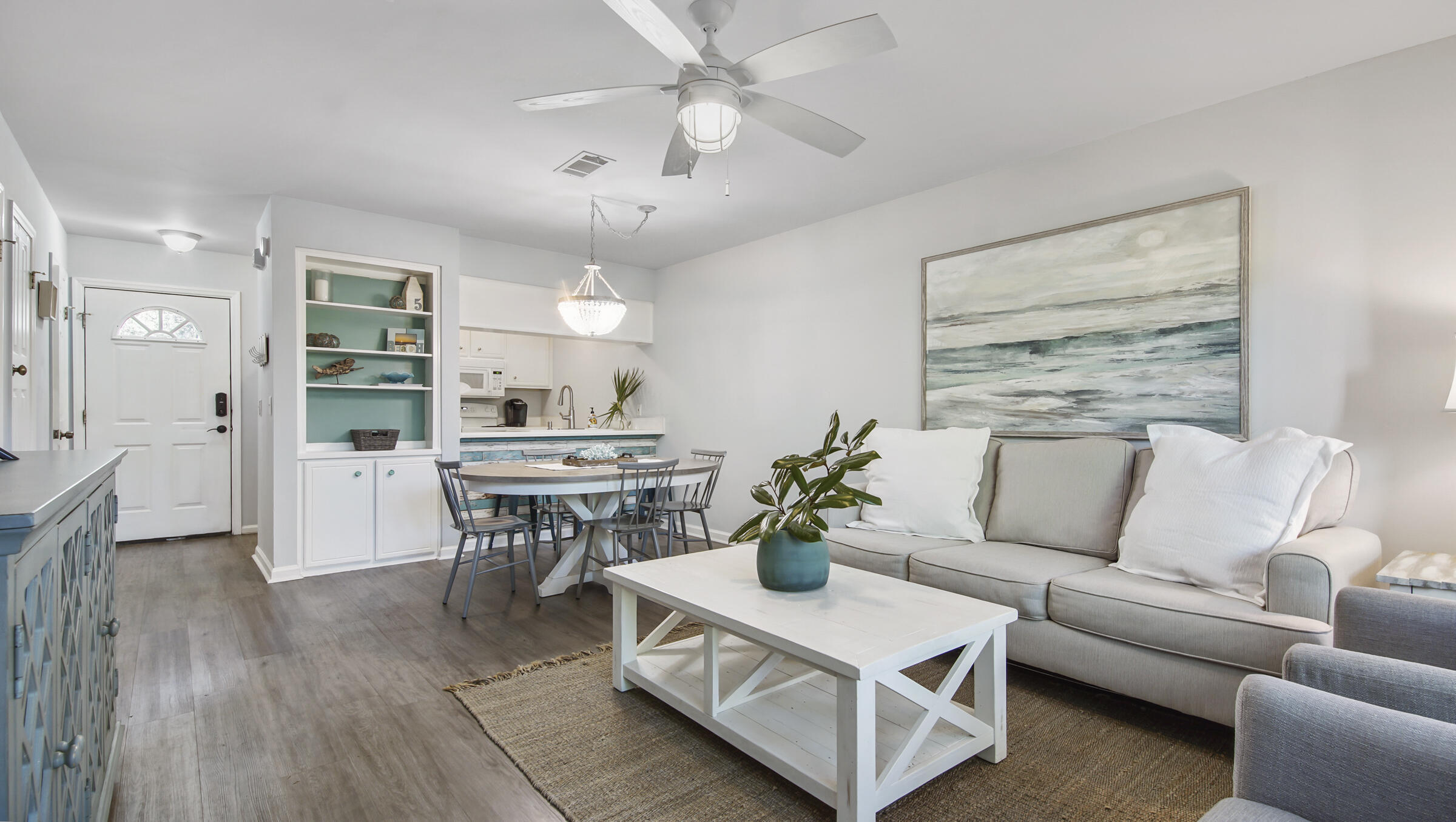 51 Cypress Street, Unit 275 Santa Rosa Beach, FL 32459 - Photo 9 of 37 a living room with furniture and a table