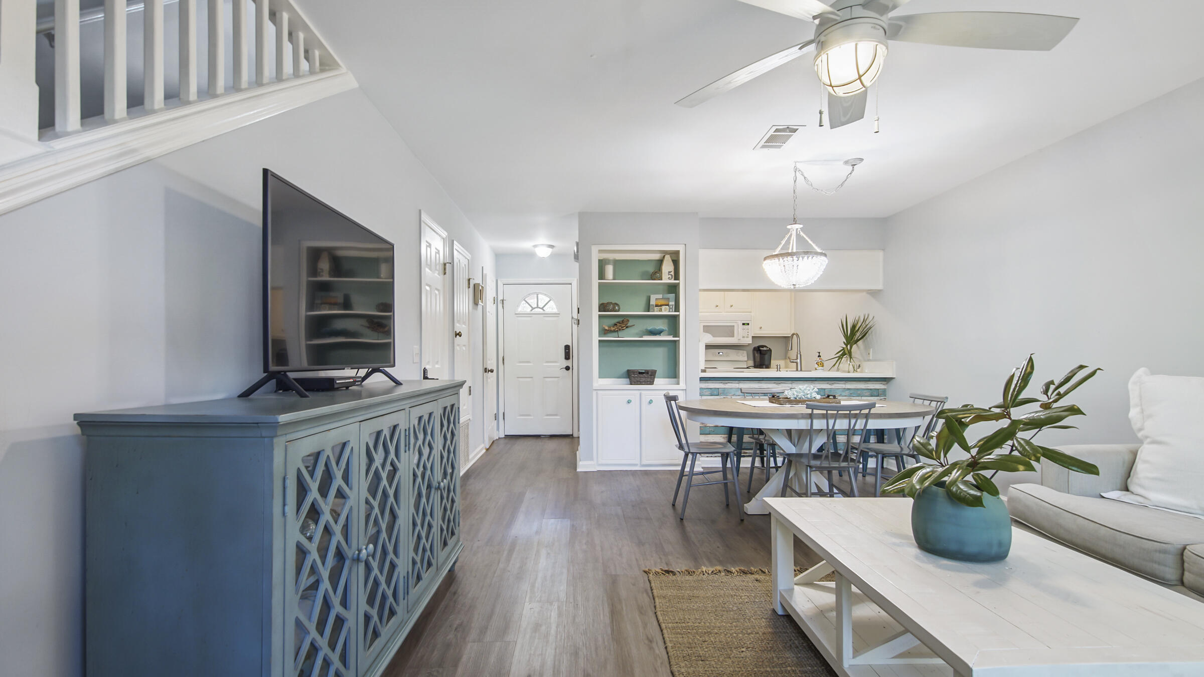 51 Cypress Street, Unit 275 Santa Rosa Beach, FL 32459 - Photo 10 of 37 a view of a dining room with furniture a kitchen and chandelier