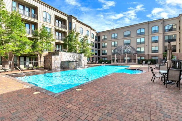 a view of a building with a garden and plants