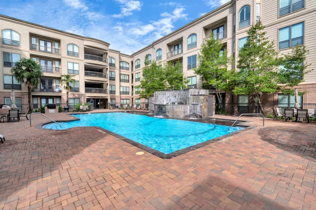 a view of a livingroom with furniture and garden view