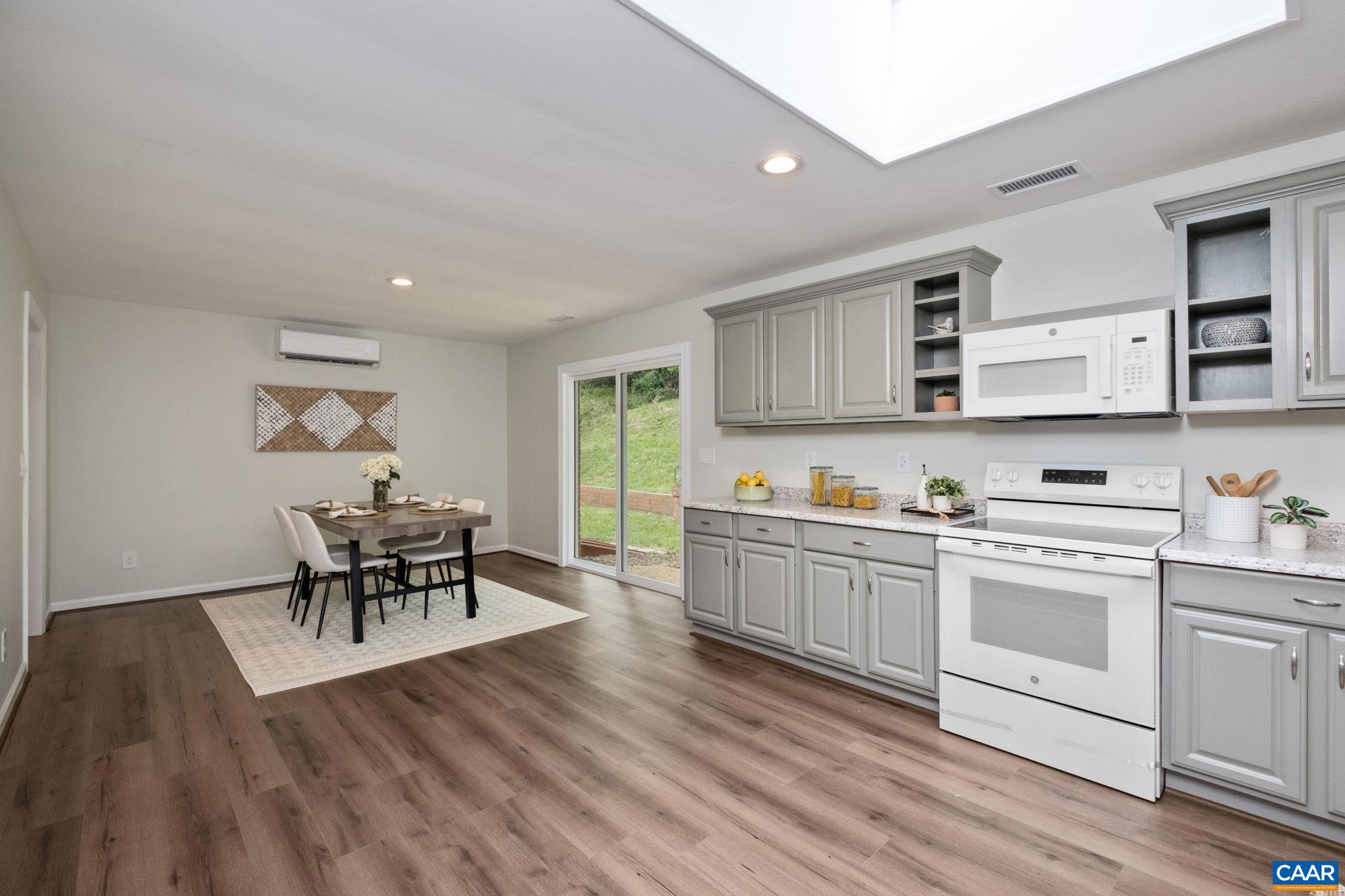 1680 Craigs Store Road Afton, VA 22920 - Photo 14 of 57 a kitchen with a table chairs stove and cabinets