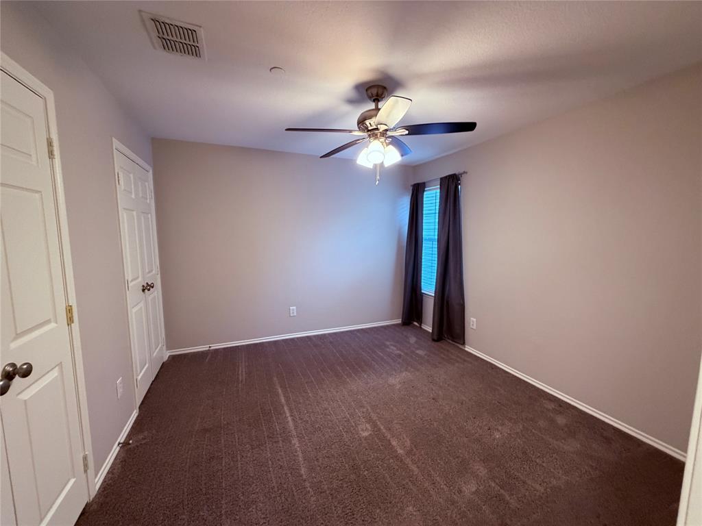 3109 Bonsai Drive Plano, TX 75093 - Photo 11 of 25 a view of an empty room with a chandelier fan