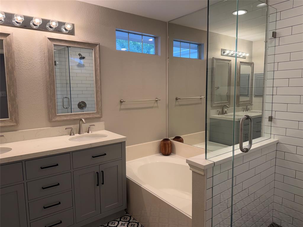 3109 Bonsai Drive Plano, TX 75093 - Photo 14 of 25 a bathroom with a sink and mirror