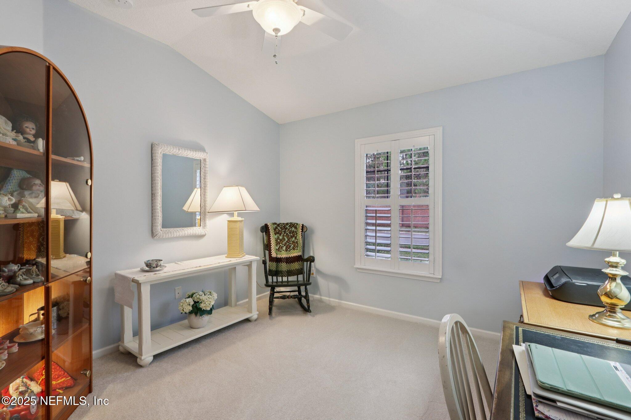 1870 Copper Stone Drive, Unit F Fleming Island, FL 32003 - Photo 22 of 36 a view of living room with furniture and a window