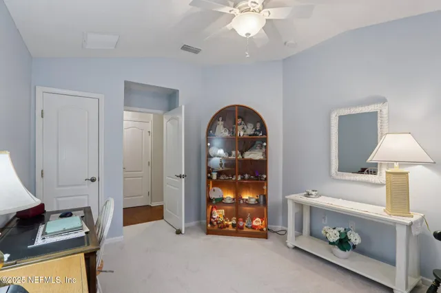 a view of an empty room with a fireplace