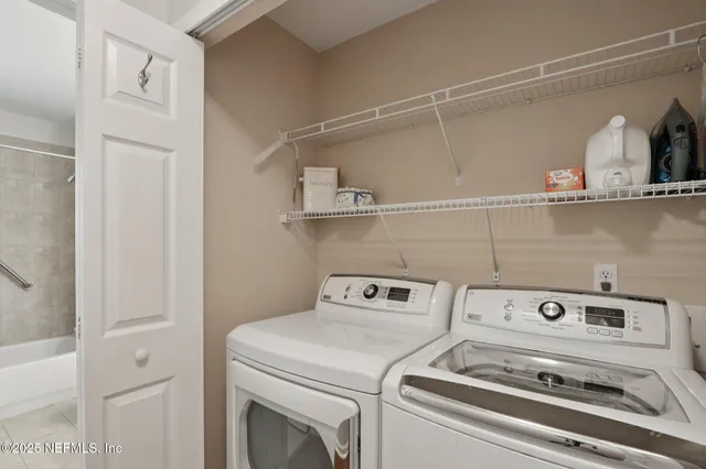 a utility room with dryer and washer