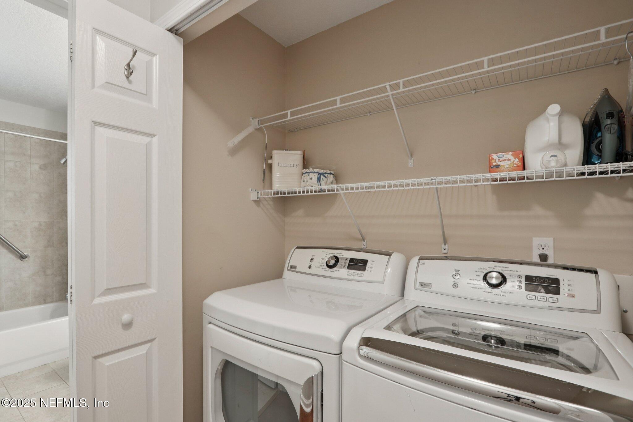 1870 Copper Stone Drive, Unit F Fleming Island, FL 32003 - Photo 24 of 36 a utility room with dryer and washer