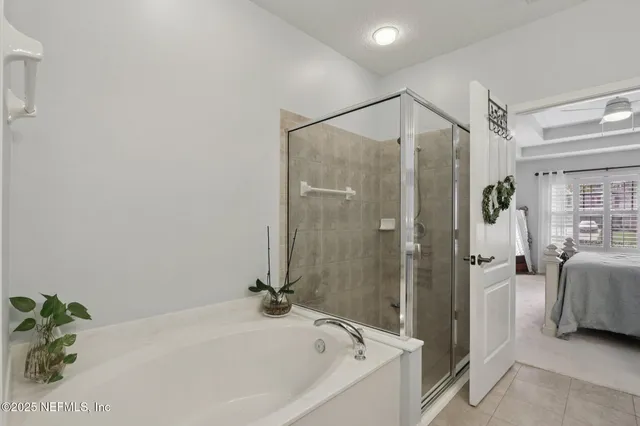 a bathroom with a tub and shower