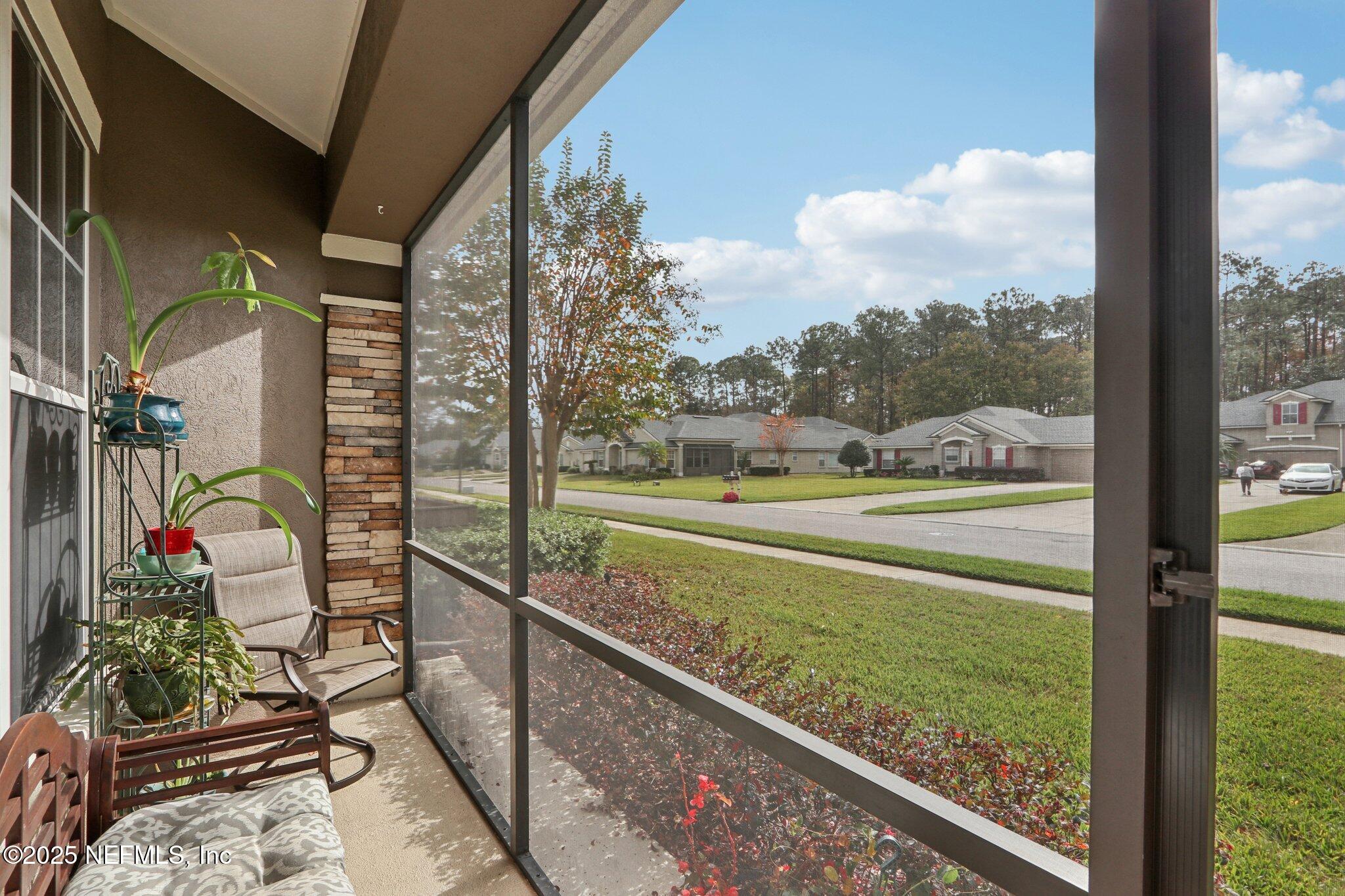 1870 Copper Stone Drive, Unit F Fleming Island, FL 32003 - Photo 35 of 36 a view of swimming pool from a balcony