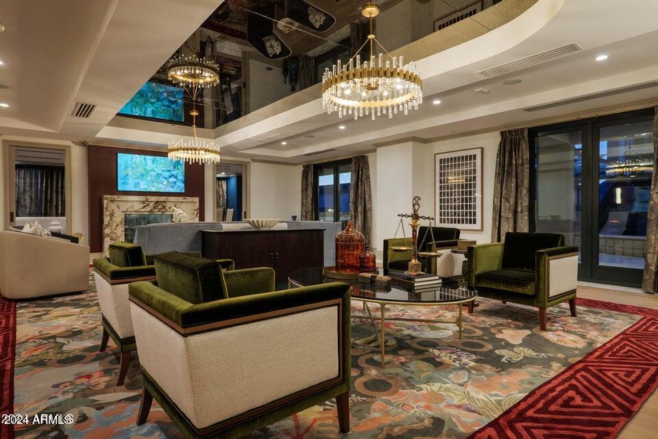 4240 East Camelback Road, Unit 214 Phoenix, AZ 85018 - Photo 17 of 20 a living room with lots of furniture and a chandelier