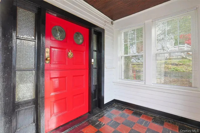 a view of entryway with wooden floor