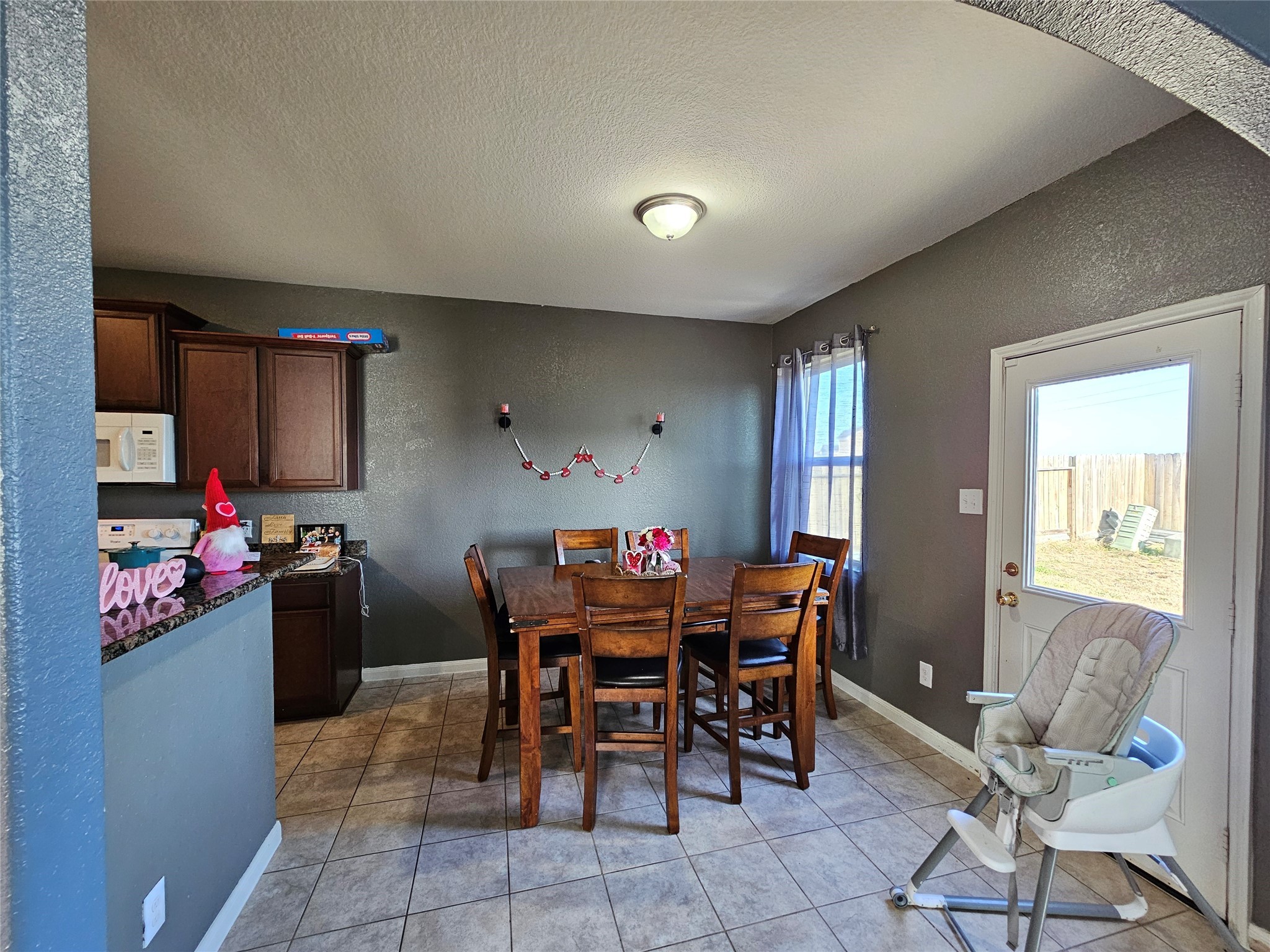 5538 Rainbow Rd. Baytown, TX 77523 - Photo 4 of 11 a view of a dining room with furniture and chandelier