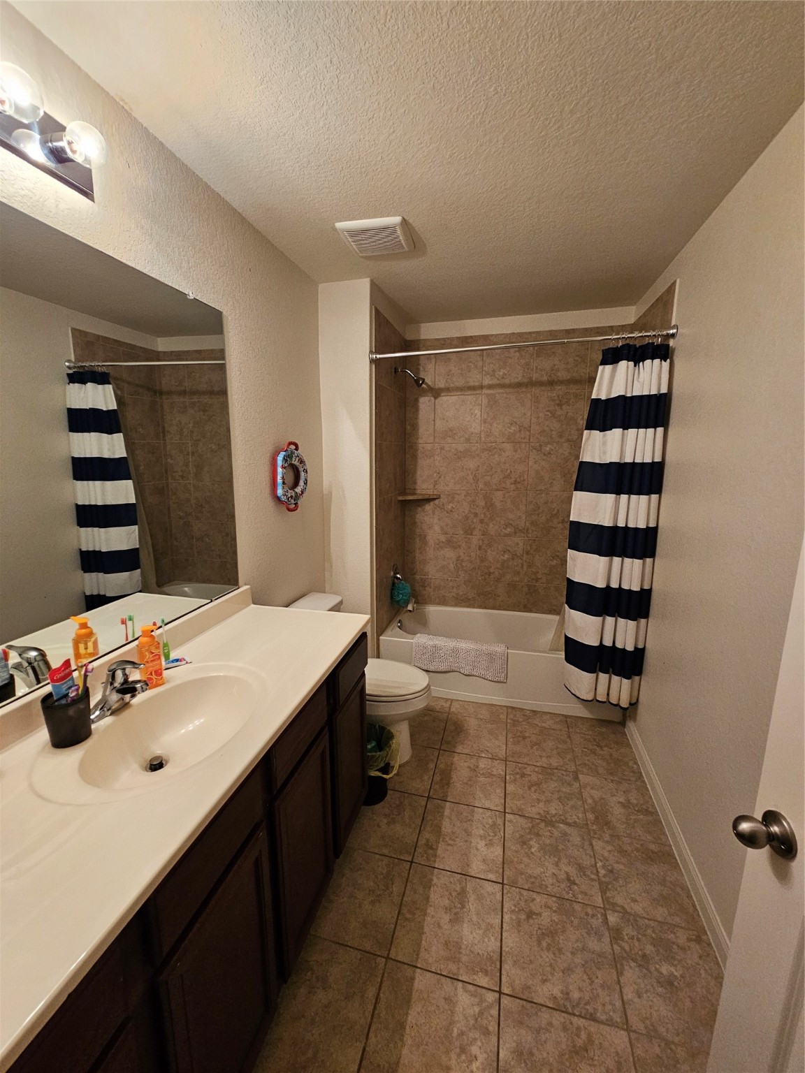5538 Rainbow Rd. Baytown, TX 77523 - Photo 6 of 11 a bathroom with a sink and a shower