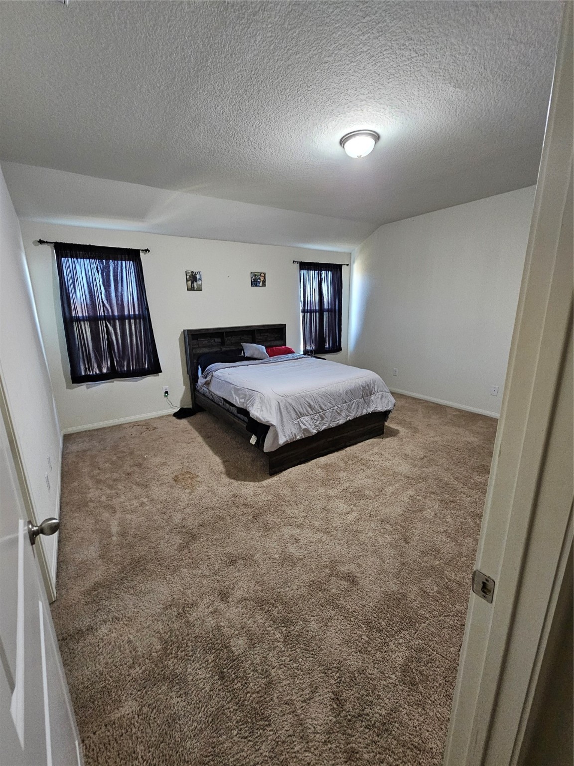 5538 Rainbow Rd. Baytown, TX 77523 - Photo 10 of 11 a spacious bedroom with a bed and window