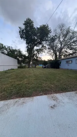 a view of a field with an ocean view