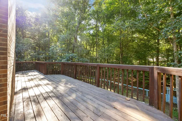 a view of balcony with wooden floor