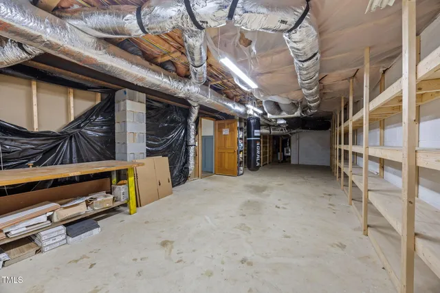 a view of an empty room with wooden roof
