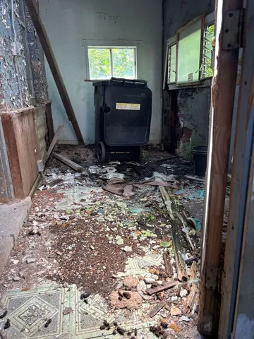 a bathroom with a granite countertop sink and a stove