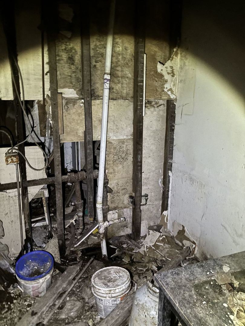 5951 South Elizabeth Street Chicago, IL 60636 - Photo 7 of 19 a bathroom with a granite countertop sink a toilet and a mirror