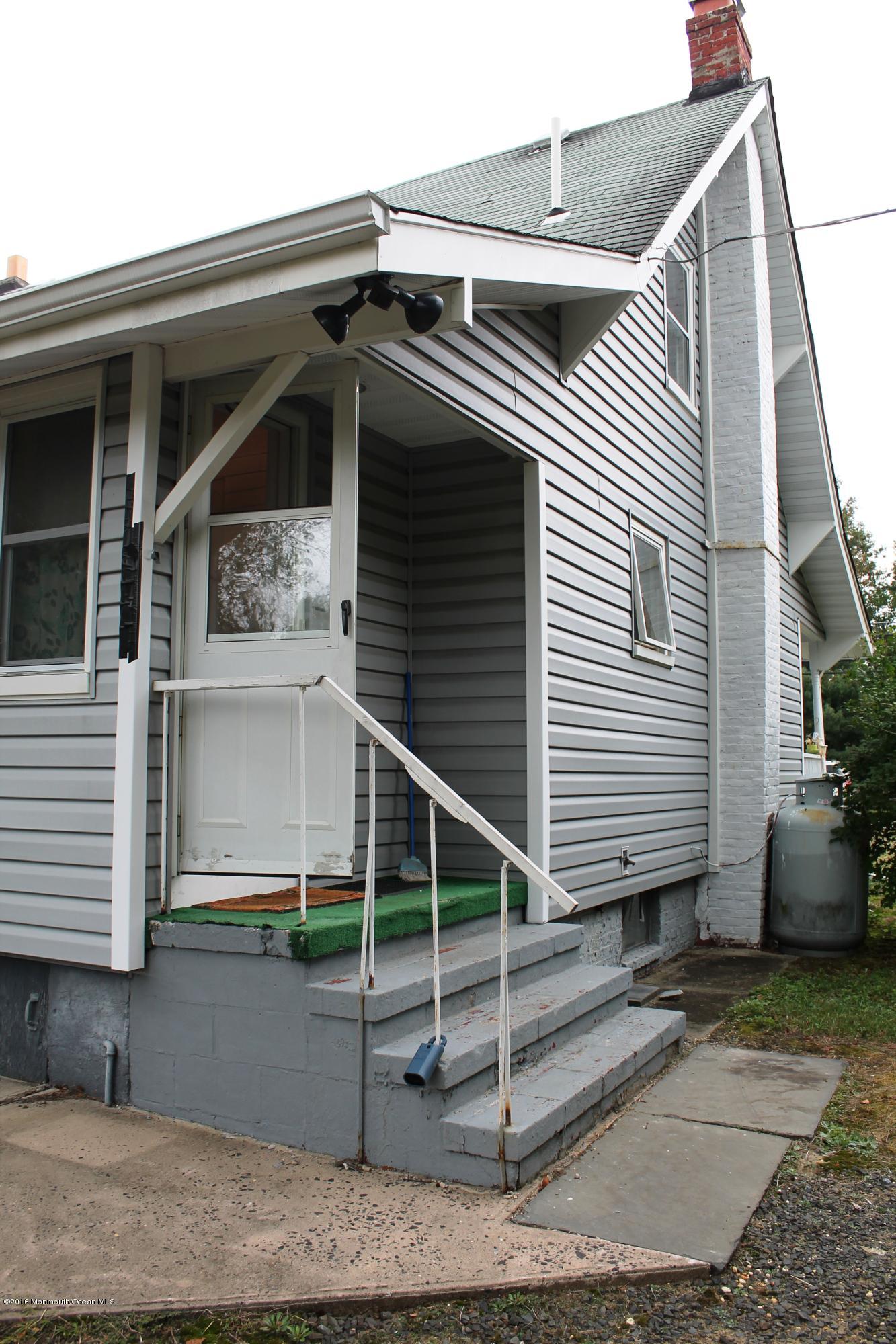 251 Tennent Road Morganville, NJ 07751 - Photo 14 of 16 a view of a house with a window