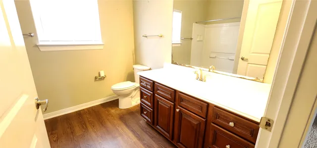 a view of an empty room with closet area