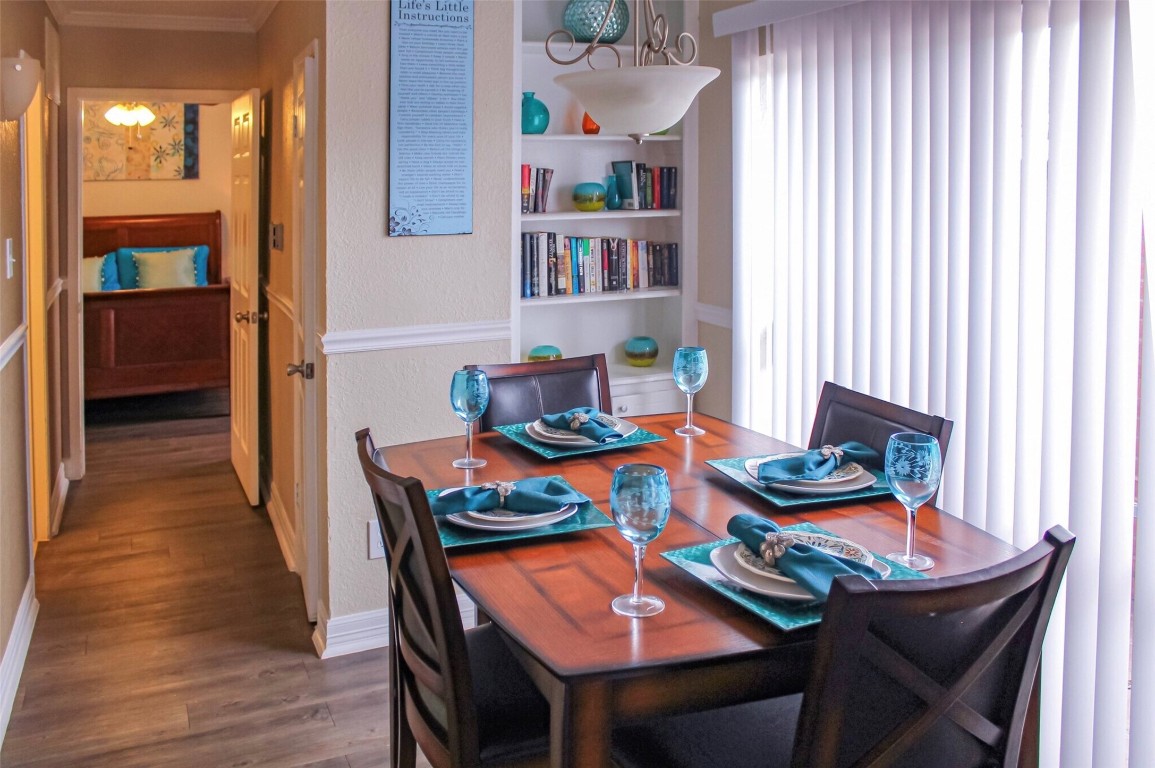 9407 Westheimer Road, Unit 305 Houston, TX 77063 - Photo 2 of 10 a outdoor dining room with furniture and wooden floor