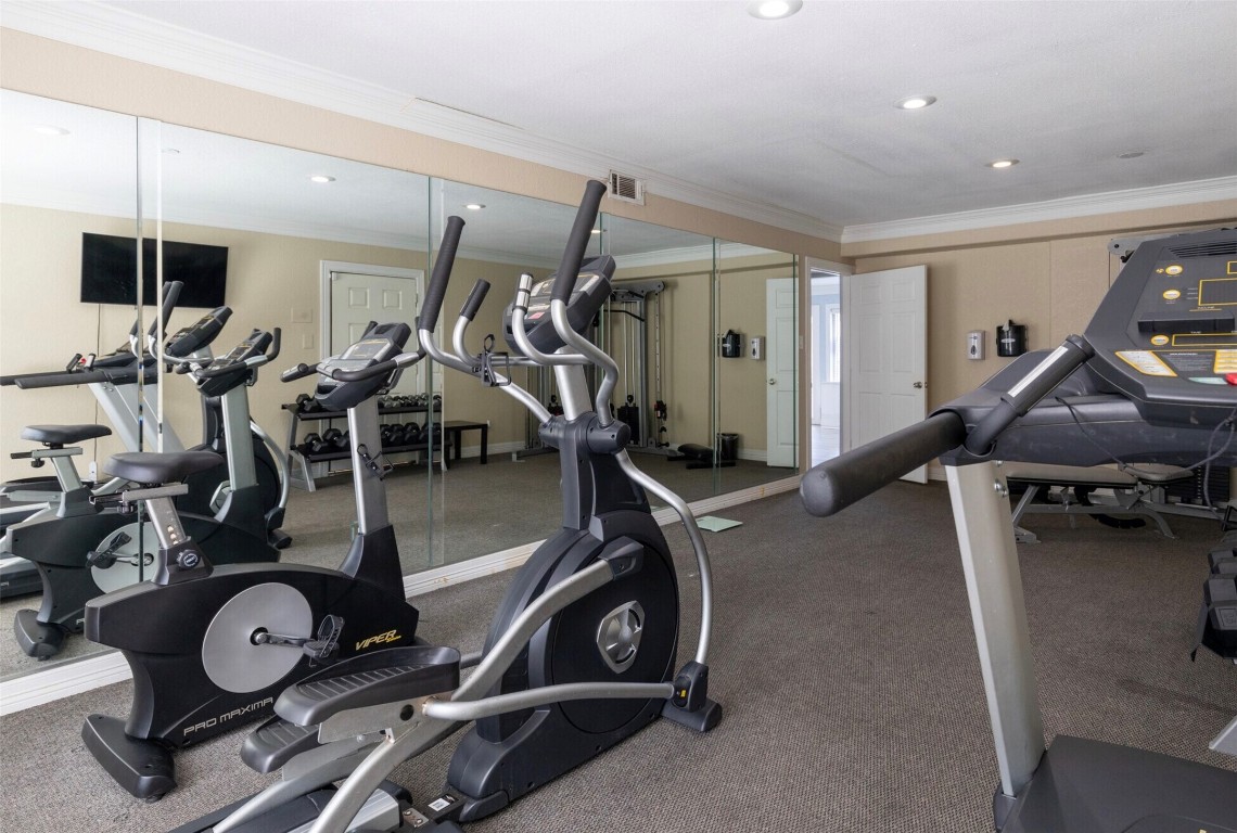 9407 Westheimer Road, Unit 305 Houston, TX 77063 - Photo 9 of 10 a view of a room with gym equipment