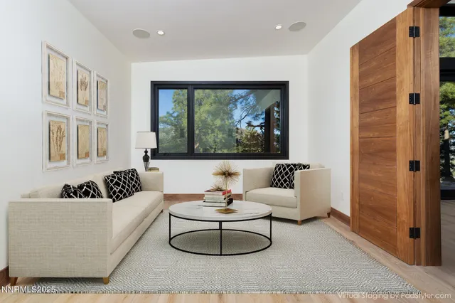 a living room with furniture and a large window