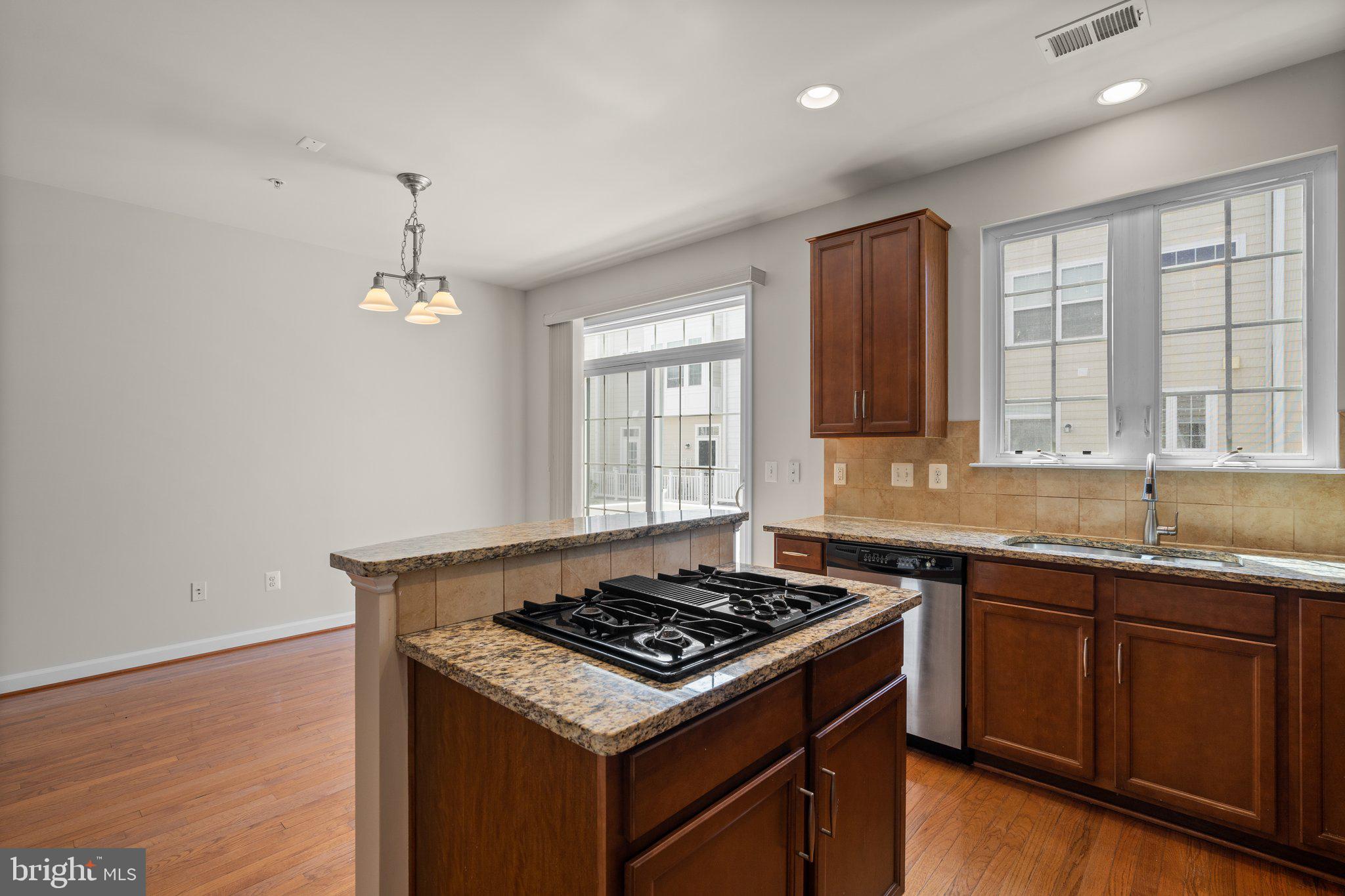 11669 Leesborough Circle Silver Spring, MD 20902 - Photo 15 of 46 a kitchen with a stove and a sink
