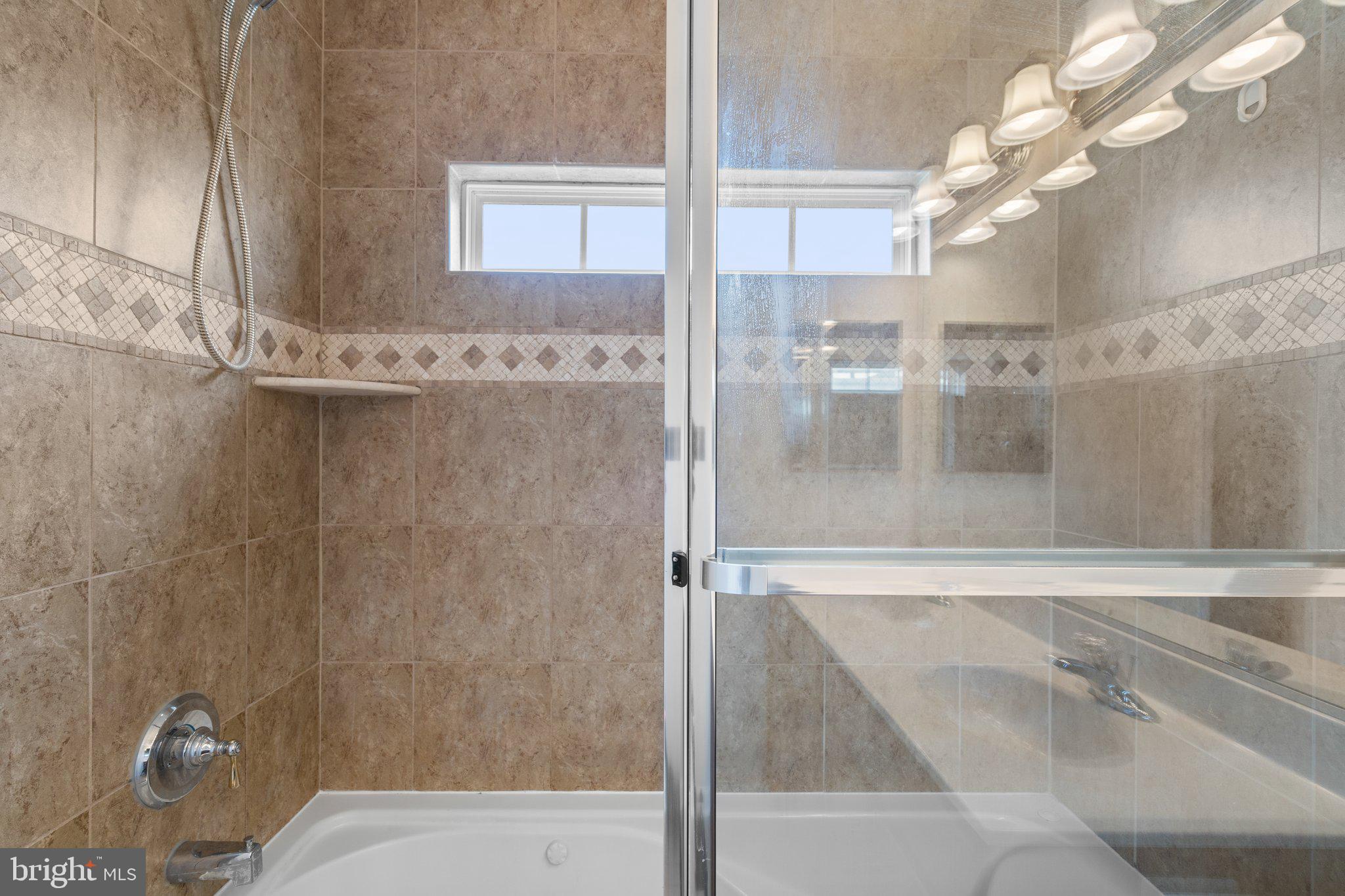 11669 Leesborough Circle Silver Spring, MD 20902 - Photo 25 of 46 a bathroom with a shower