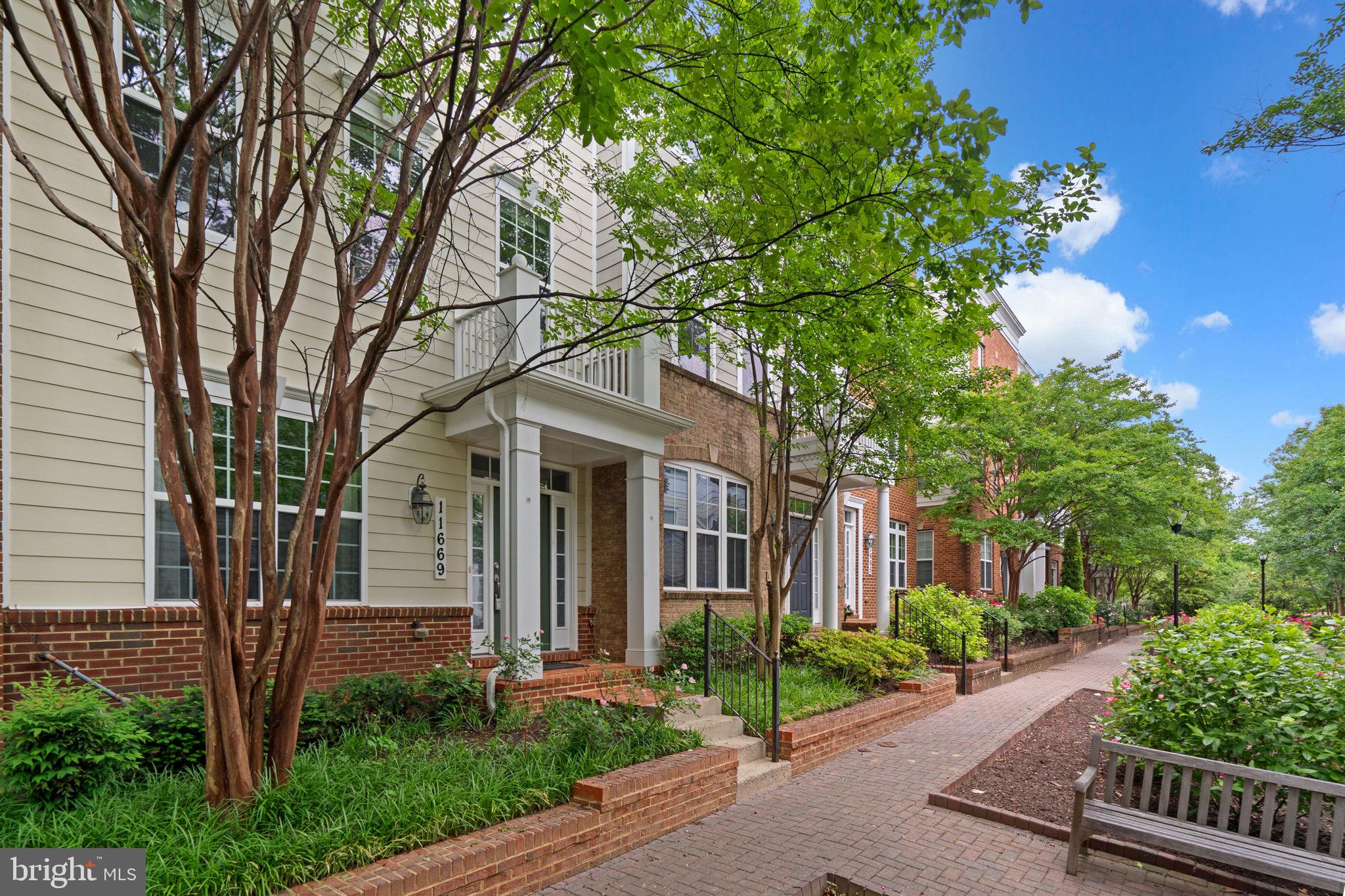 11669 Leesborough Circle Silver Spring, MD 20902 - Photo 3 of 46 a front view of a house with garden
