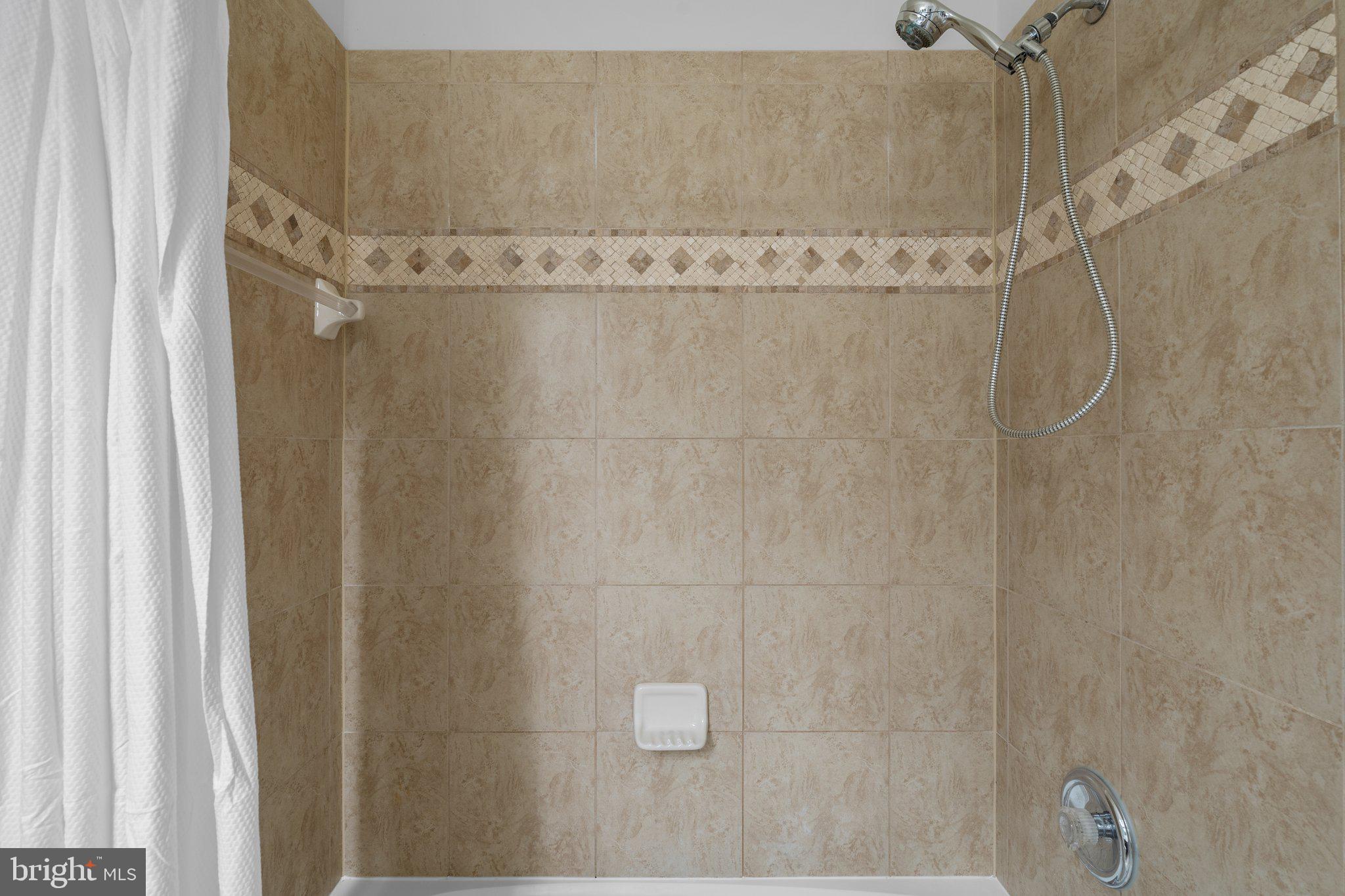 11669 Leesborough Circle Silver Spring, MD 20902 - Photo 32 of 46 a bathroom with a shower